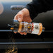 Cowboy Butter Rub seasoning container being shaken, showing label details.