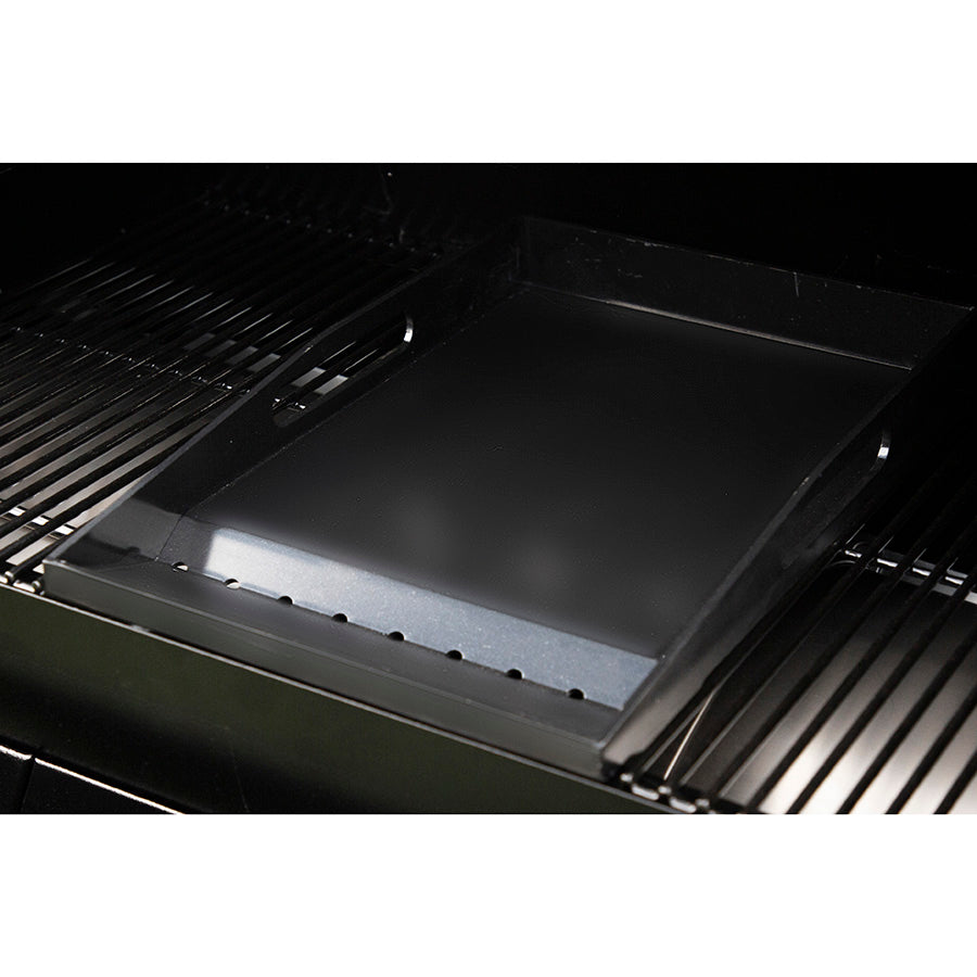 Black griddle accessory for barbecue grill.