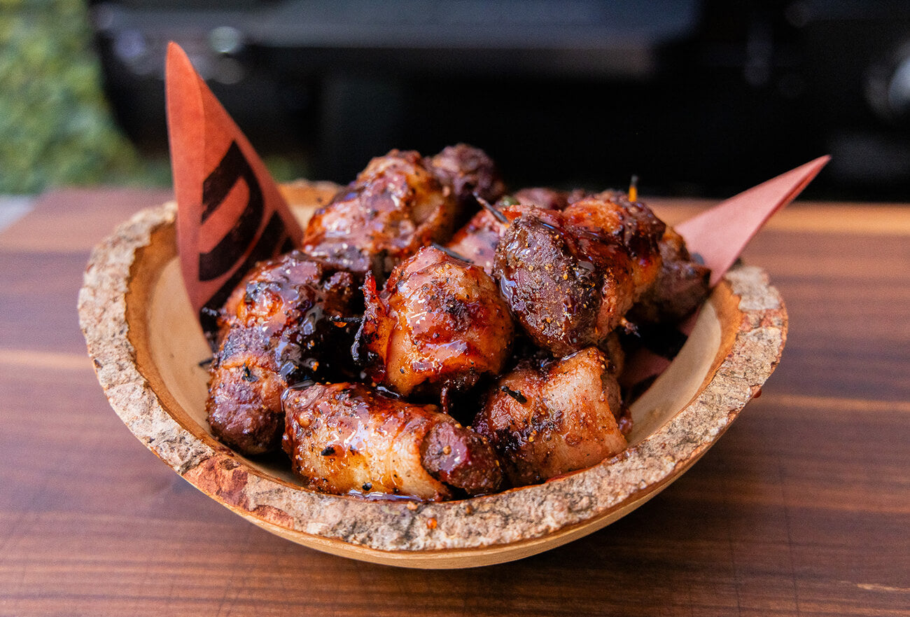 Bacon Wrapped Grilled Venison Tenderloin Bites cooked on Pit Boss Wood Pellet Grill in Wooden Bowl