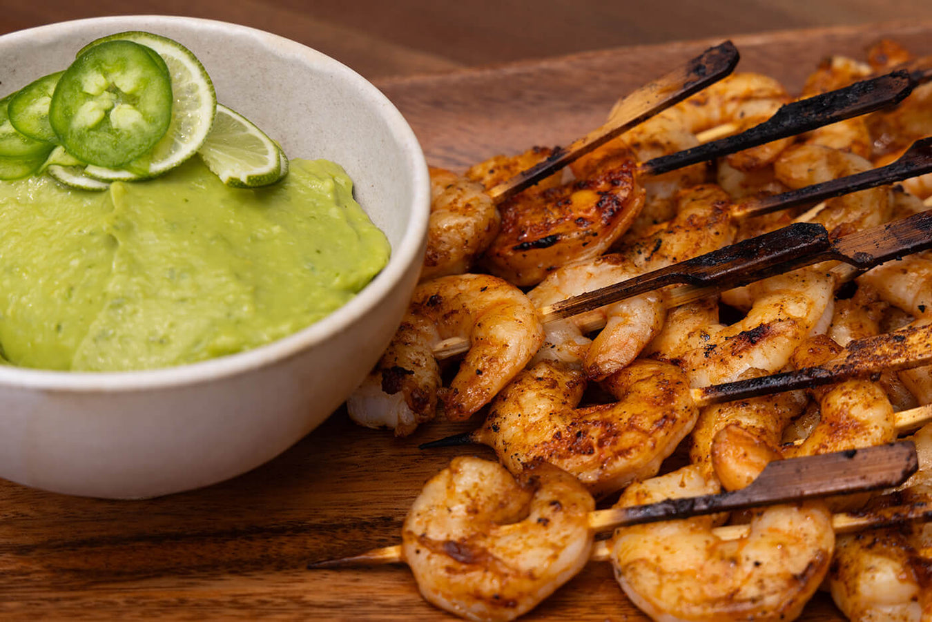 grilled shrimp on skewers with homemade avocado puree dip sauce