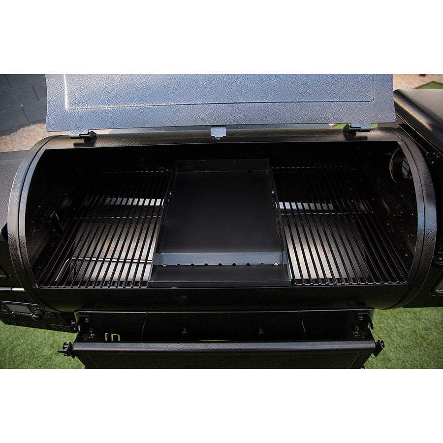 Black grill with open lid, showing cooking grates and warming rack.