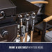 "Black grill with front and side shelf tool hooks labeled 'PIT BOSS'."