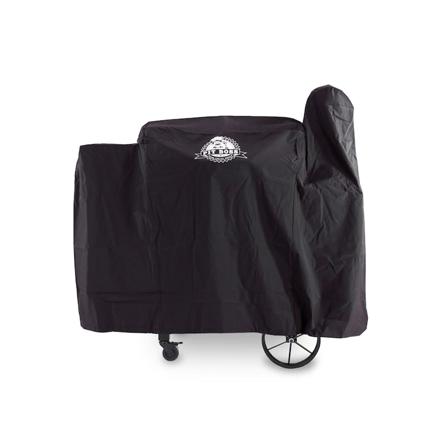 Black Pit Boss grill cover with wheels, protecting outdoor cooking equipment.