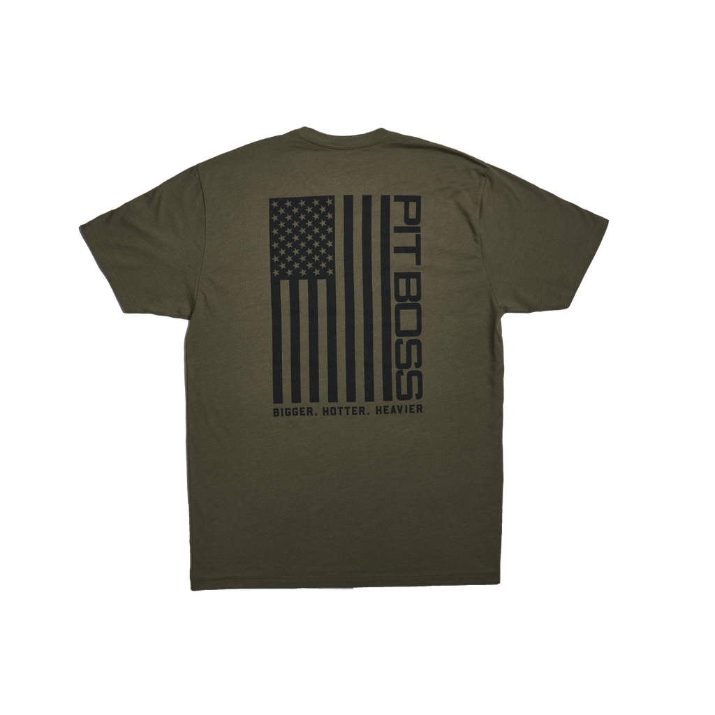 Olive green t-shirt with "PIT BOSS" and American flag design, "BIGGER. HOTTER. HEAVIER." text.