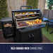 Black Pit Boss Titan grill with 1623-square-inch cooking space, displaying various grilled foods.