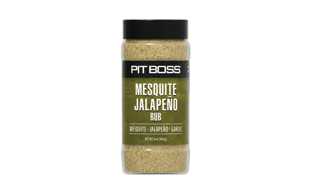 Pit Boss Mesquite Jalapeño Rub, 16 oz bottle. Green label, black lid. Contains mesquite, jalapeño, and garlic.