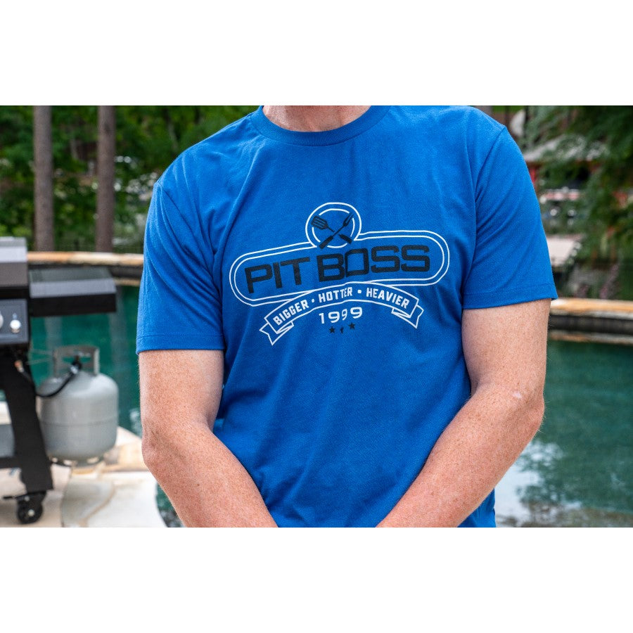 Blue Pit Boss t-shirt with "Bigger · Hotter · Heavier 1999" design.