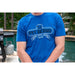Blue Pit Boss t-shirt with "Bigger · Hotter · Heavier 1999" design.