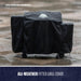 Black all-weather fitted grill cover protecting outdoor grill.