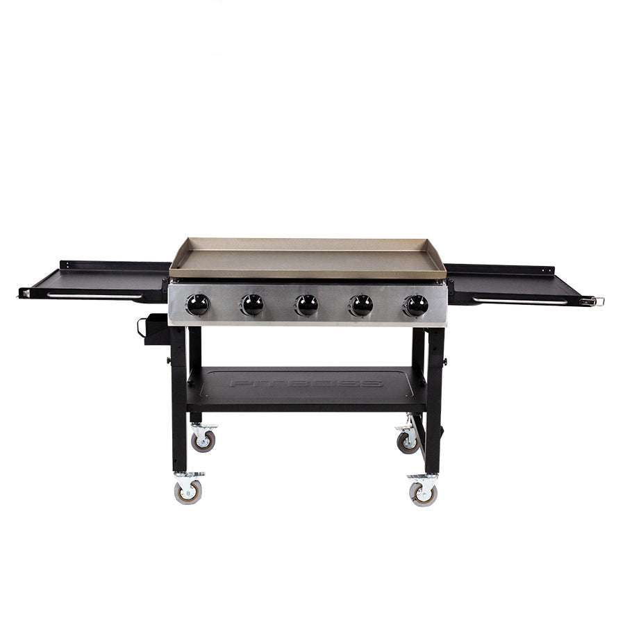 "Black and stainless steel Pit Boss griddle with four burners and side shelves on wheels."