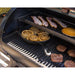 Black grill with cast iron skillet, bacon, cinnamon rolls, and breakfast patties.