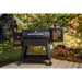 Black Pit Boss Sportsman pellet grill with digital control panel and wheels.