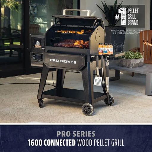 Black Pro Series 1600 Connected Wood Pellet Grill with accessories and food cooking.