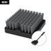 Black grooming brush with dense bristles and handle.