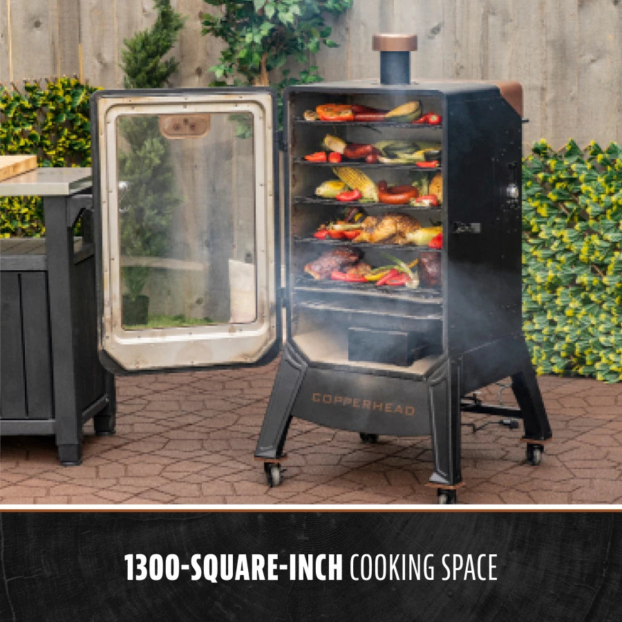 Copperhead smoker with 1300-square-inch cooking space, filled with vegetables and meats.