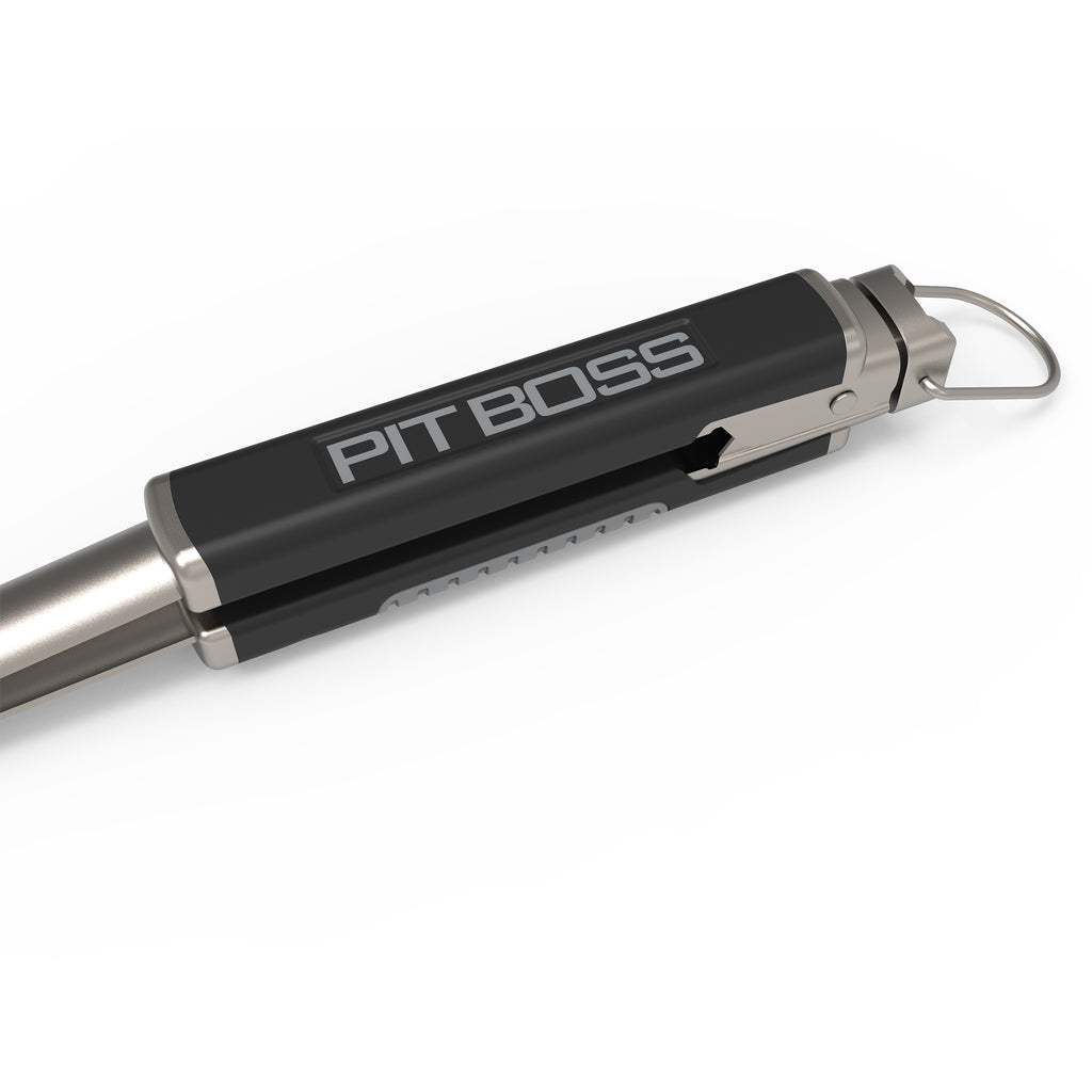 Pit Boss branded black and silver grilling tool with a metal clip and key ring attachment.