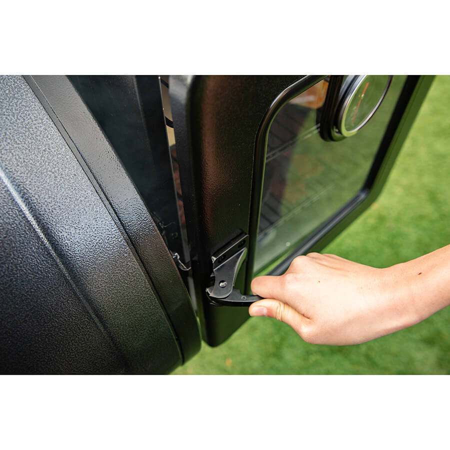 Black vehicle door handle with hand gripping it.