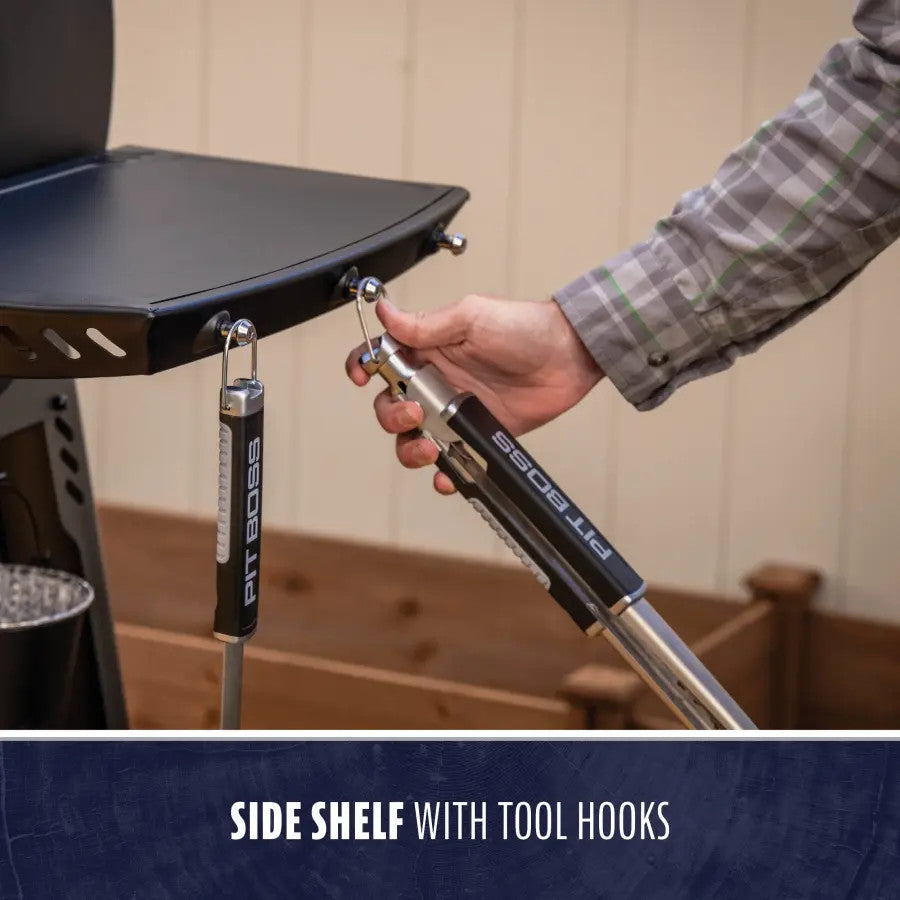 "Side shelf with tool hooks, black and silver, PIT BOSS brand."