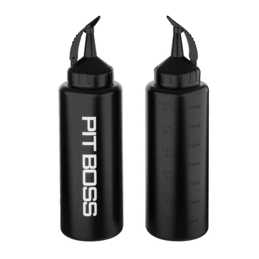 Pit Boss Ultimate Squeeze Bottle being used to squeeze sauce on sandwich.