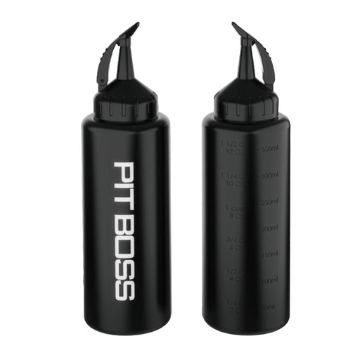 Pit Boss Ultimate Squeeze Bottle being used to squeeze sauce on sandwich.