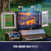 Smpoker doors open shown with meats and veggies on all three levels of the grilling rack. Grill located in a backyard.