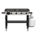 Pit Boss Deluxe 4-Burner Griddle. Both side tables open. Black grill with beige and silver accents. Front view.