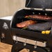 Pit Boss Carbon Series 500 wood pellet grill, front angled view with lid open showing cooking grates and grilling area
